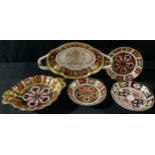 A pair of Royal Crown Derby Imari 1128 circular trinket trays; an 1128 pedestal bon-bon dish,