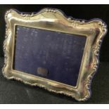 A Victorian style silver easel photograph frame, the aperture 9.5cm x 13.5cm, Sheffield 1997, boxed