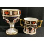 A Royal Crown Derby Imari 1128 pattern goblet, an 1128 pattern loving cup, seconds (2)
