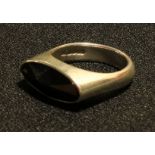 A gentleman's silver and onyx ring