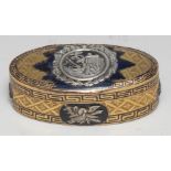 A19th century silver mounted gilt metal and enamel oval snuff box, applied with a tomb and triumphal