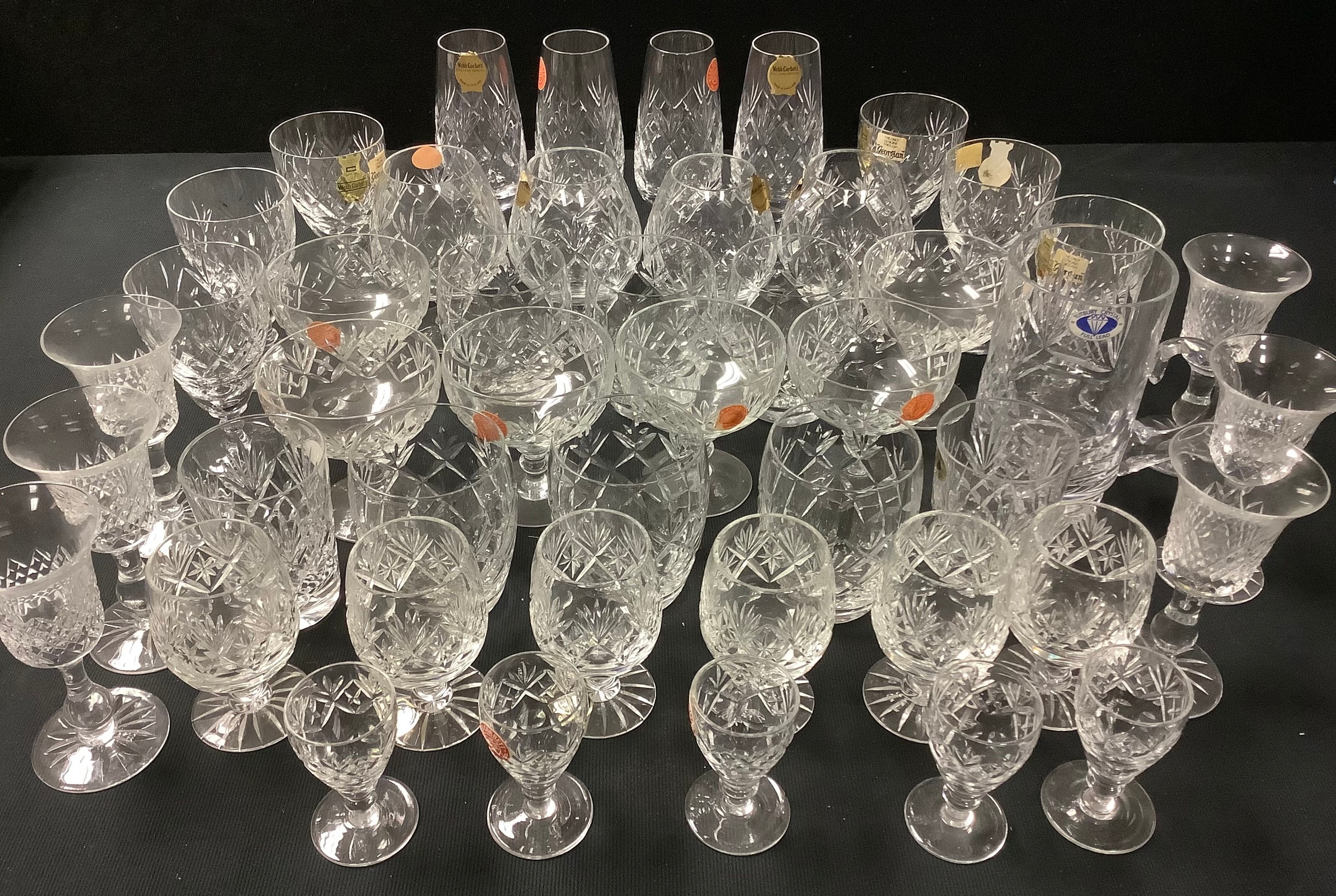 A set of six Webb Corbett "Georgian" wine glasses, six Webb Corbett coupe glasses, four brandy