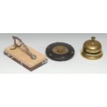 An early 20th century cast brass desk or counter bell, 10cm diam; a marble and silvered bronze