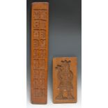Treen - a Continental beech biscuit mould, intaglio carved with figures and animals, 69.5cm long;