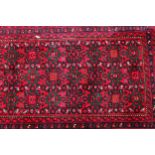 A Middle Eastern woollen runner, with geometrical gulls, 71cm x 500cm long