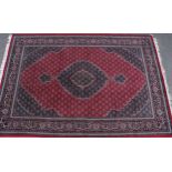 A woollen carpet, worked in the traditional Middle Eastern manner, 300cm x 200cm