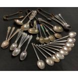 Nine silver seal top spoons; silver twelve other coffee spoons; three sets of sugar bows; silver