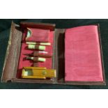 A late 19th century tooled morocco travelling writing necessaire, enclosing miniature envelopes,