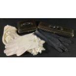 Two leather glove cases, with gloves; a silk evening scarf; a pair of leather evening gloves