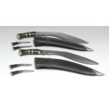 A Nepalese or Indian kukri, 29.5cm blade, horn grip, leather scabbard, skinning knives en suite,