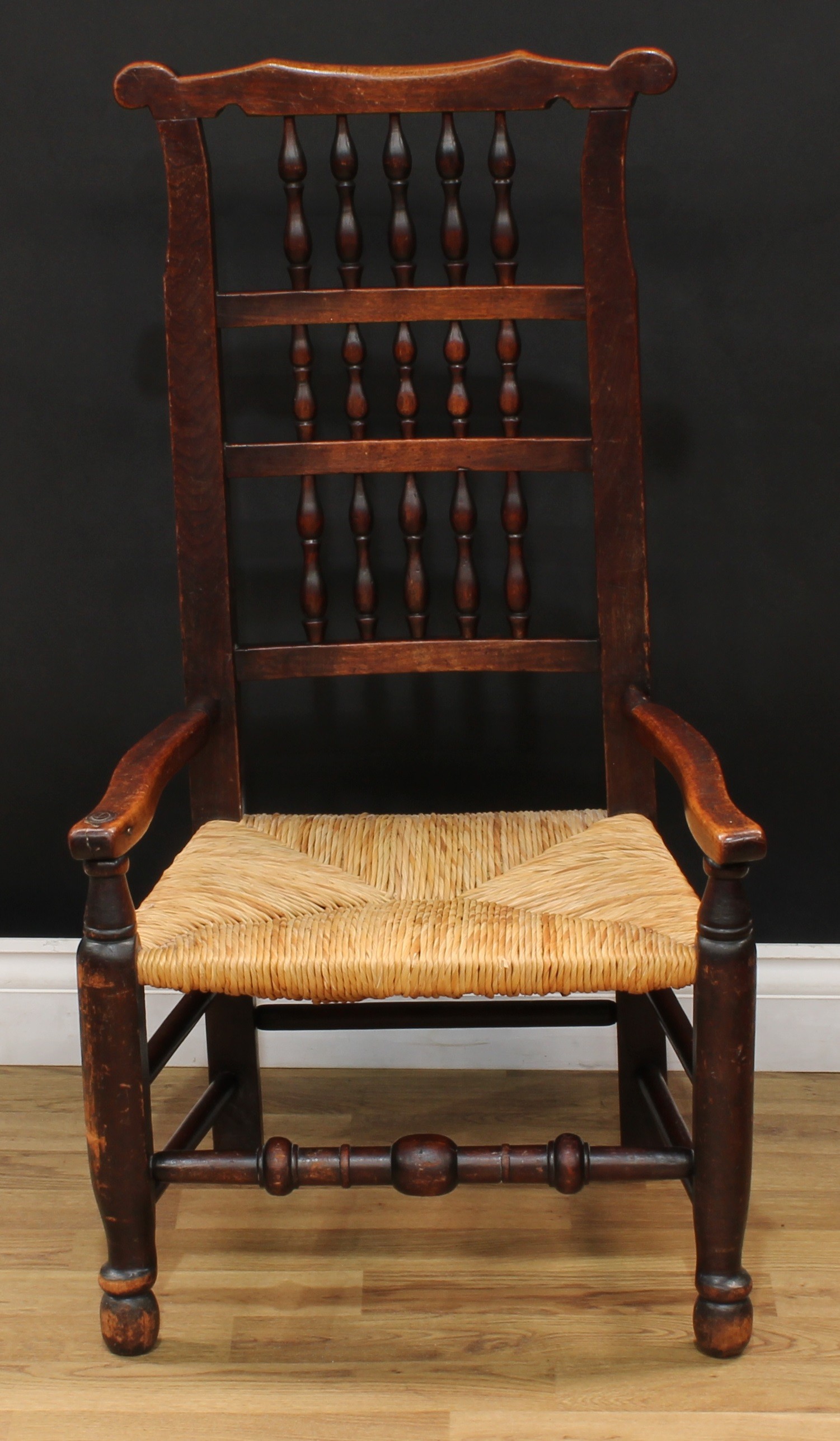 A 19th century rush seated spindle-back elbow chair, turned front stretcher, 96cm high, 52cm wide, - Bild 2 aus 4