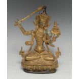 Chinese School, a gilt bronze, Manjushri Tara, seated in meditation with sword, lotus base,