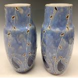 A pair of early 20th century Royal Doulton tube lined vases, c.1915, 21.5cm high