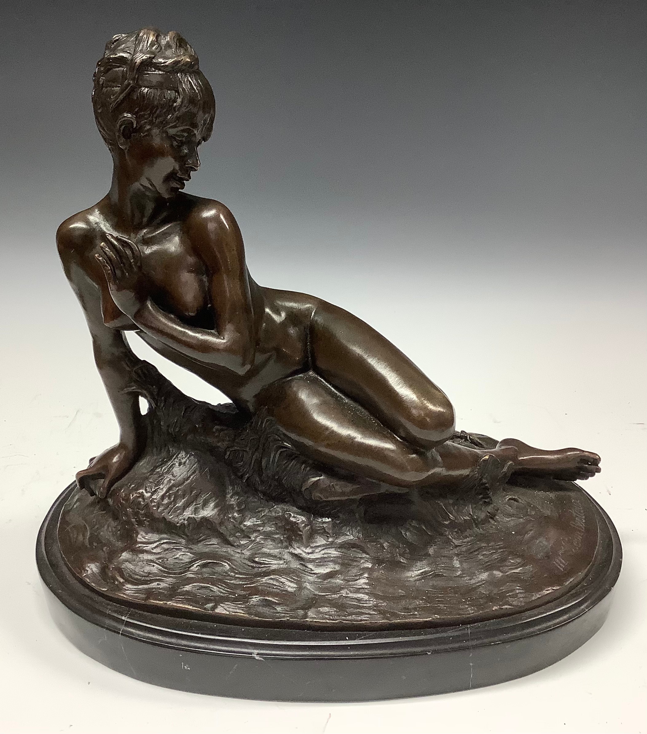 A French dark patinated bronze, after Mme. Leon Bertaux, female nude reclining, signed in the