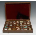 Geology - a collection of mineral samples, the specimens laid out within thirty five compartments,