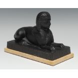 A 19th century pressed glass model of a sphinx, possibly by John Derbyshire, rectangular marble