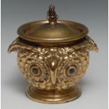 An early 20th century brass novelty tobacco jar, as an owl's head, double-sided, 16cm high