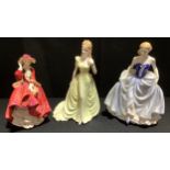 A Royal Doulton figure, Top of the Hill; Royal Doulton Classics Susan; a Coalport Ladies of