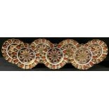 A set of seven Royal Crown Derby Imari 1128 pattern shaped circular dessert plates, 21.5cm,