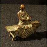 A Chinese bronze miniature, Buddha, seated on a bench, 6.5cm wide