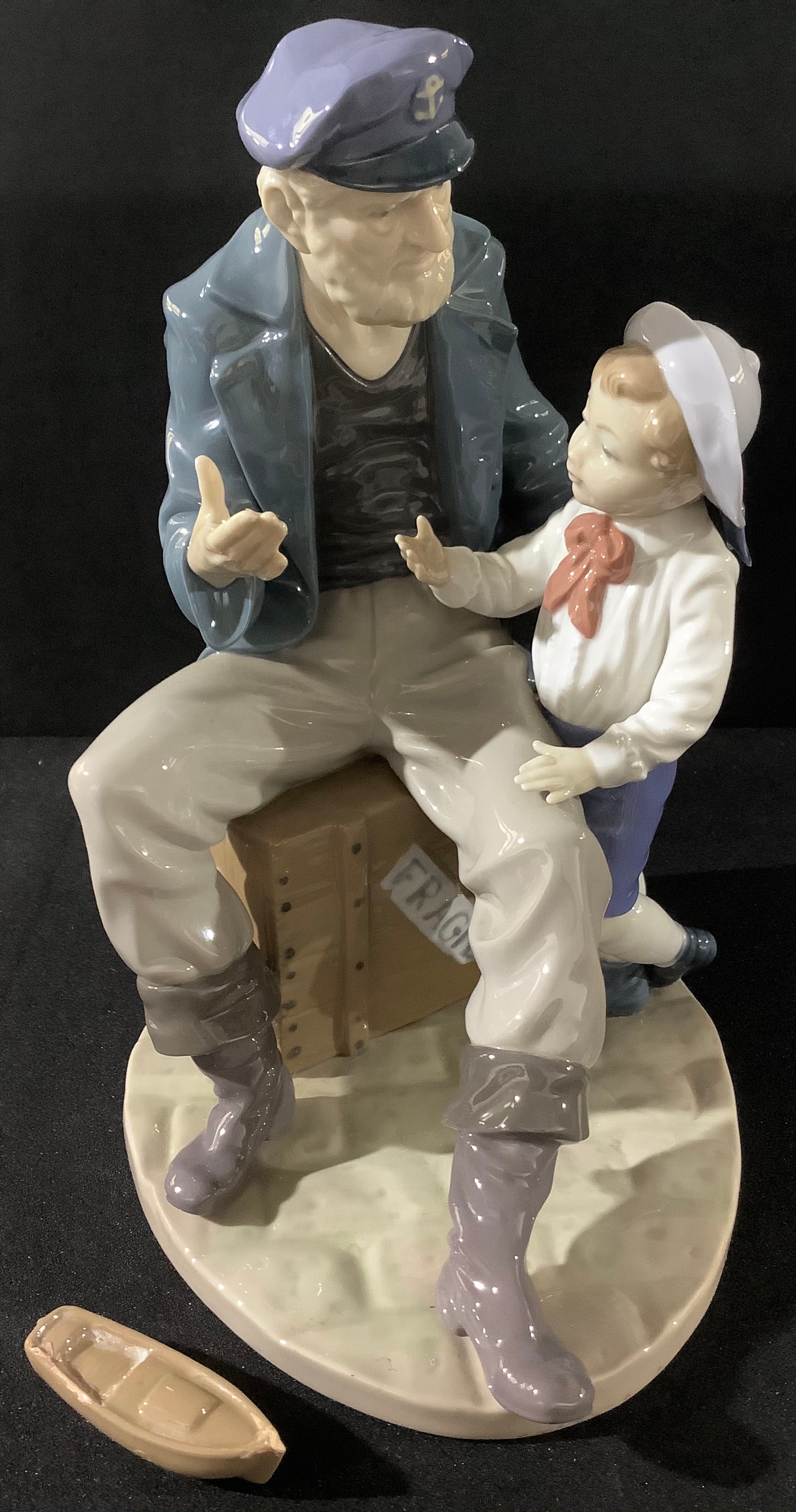 A Lladro figure, of an Old Sailor and a Young Boy, 29cm high, printed mark