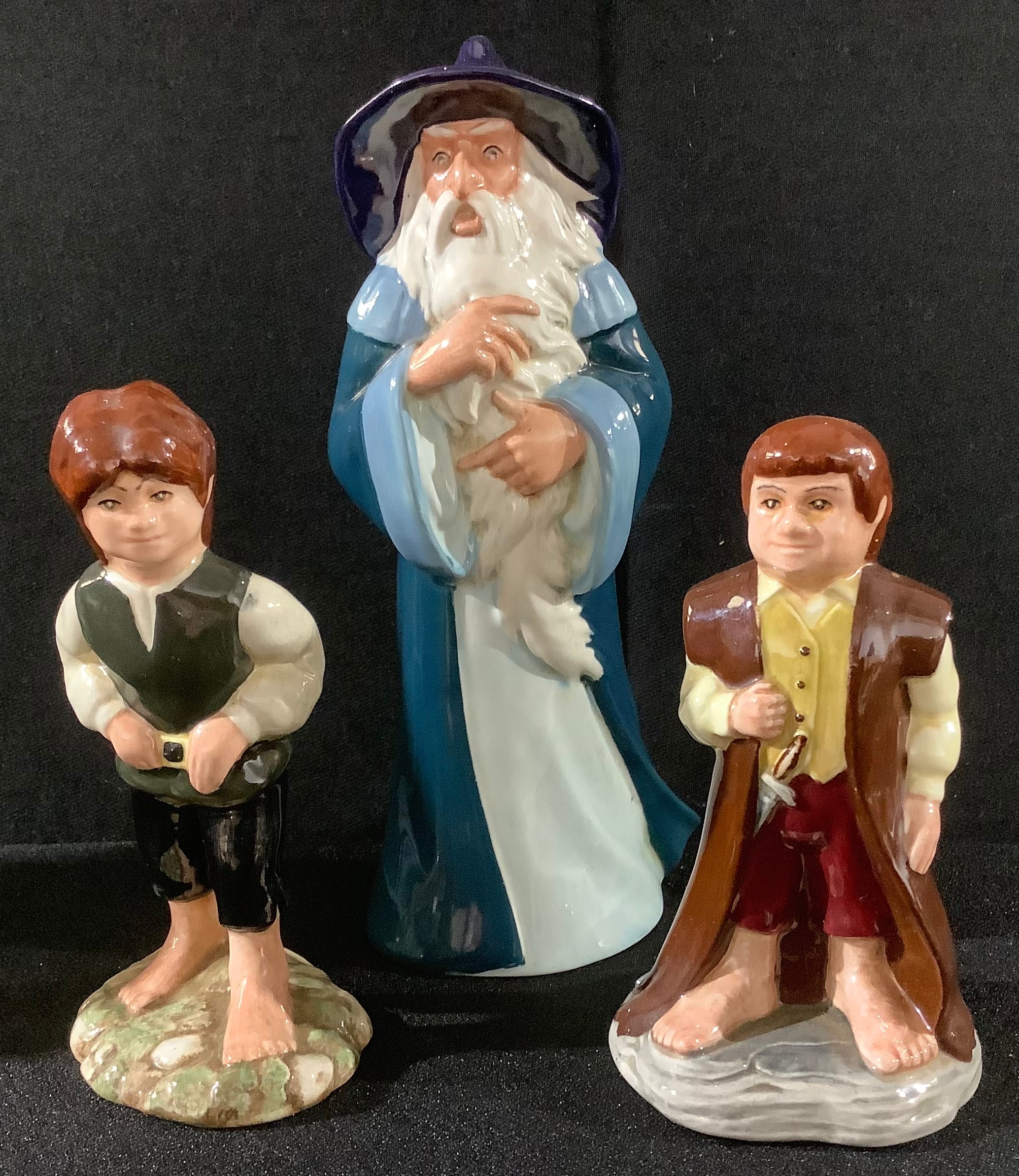 A set of three Royal Doulton The Lord of the Rings Middle Earth figures, Gandalf HN2911, Bilbo