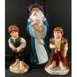 A set of three Royal Doulton The Lord of the Rings Middle Earth figures, Gandalf HN2911, Bilbo