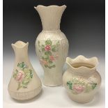 A Belleek baluster vase applied in relief with pink blossom, 140th Anniversary edition 1857 -
