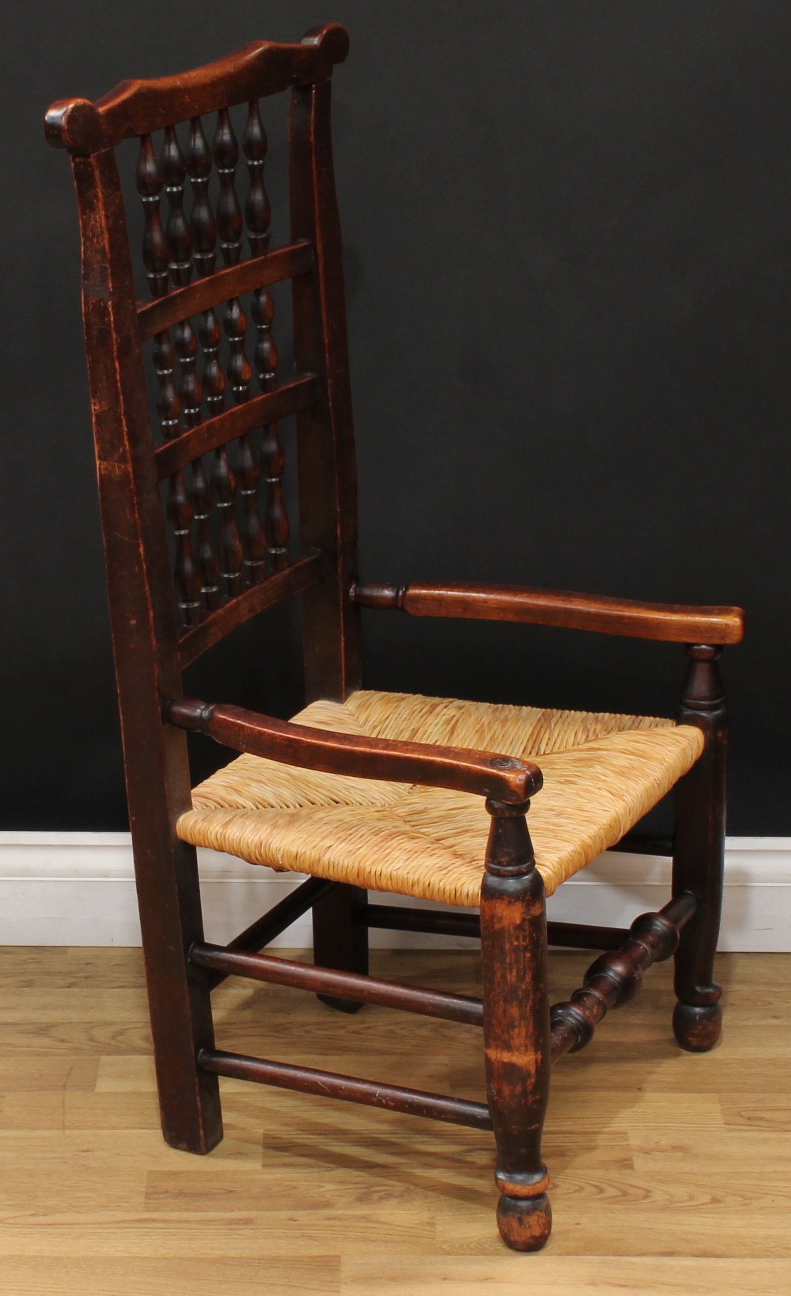 A 19th century rush seated spindle-back elbow chair, turned front stretcher, 96cm high, 52cm wide, - Bild 3 aus 4