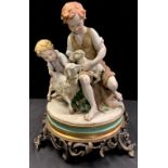A Capo-Di-Monte figure group, signed Benacchio, children with sheep and lamb, cast gilt metal