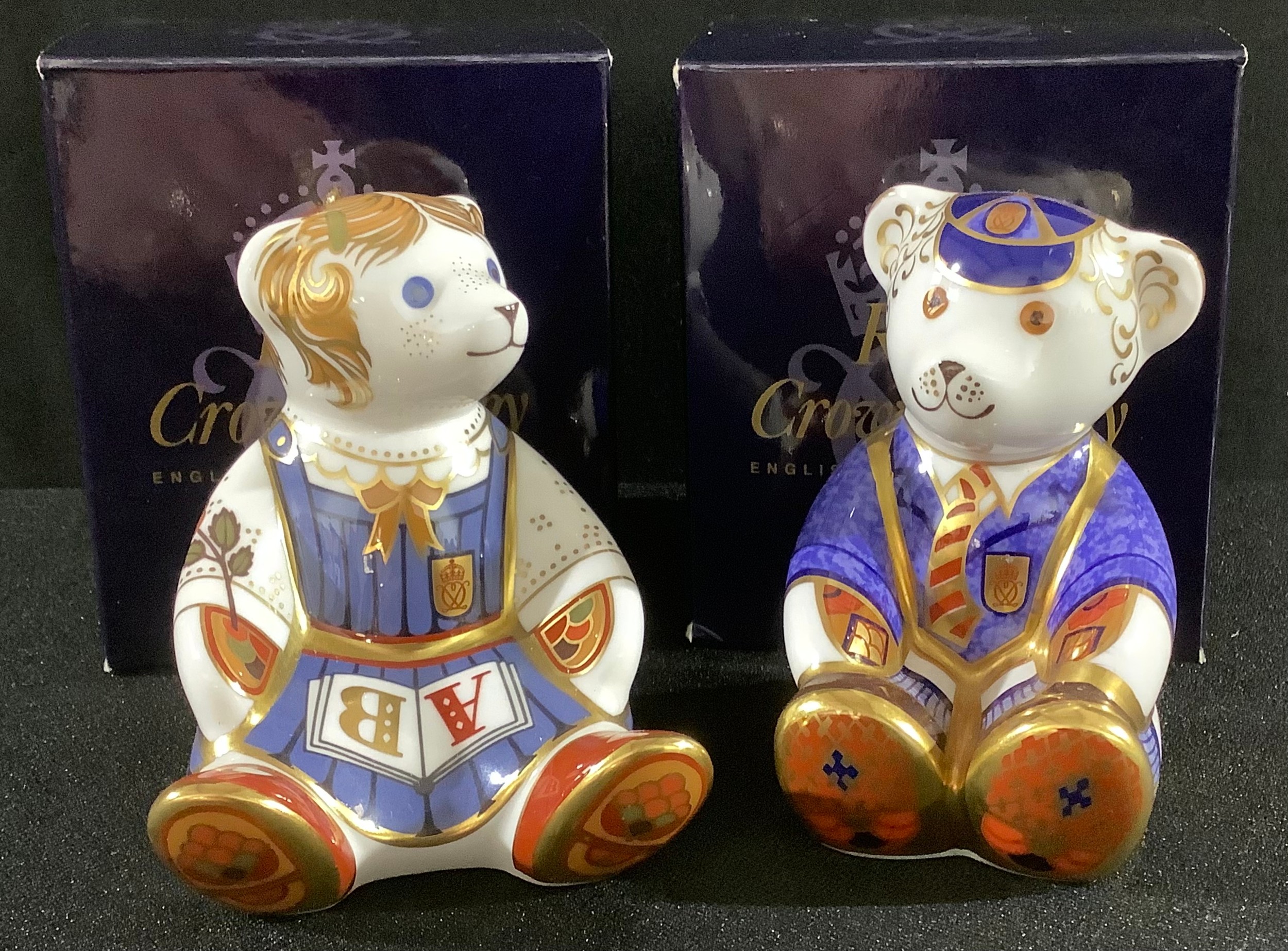 A Royal Crown Derby paperweight, School Boy Teddy, gold stopper, boxed; another, School Girl