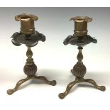 A pair of Arts and Crafts brass and copper candlesticks, in the manner of W A S Benson, 16cm high