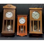 An oak chiming wall clock, Arabic numerals, twin winding holes, pendulum and key, 78cm; a French oak