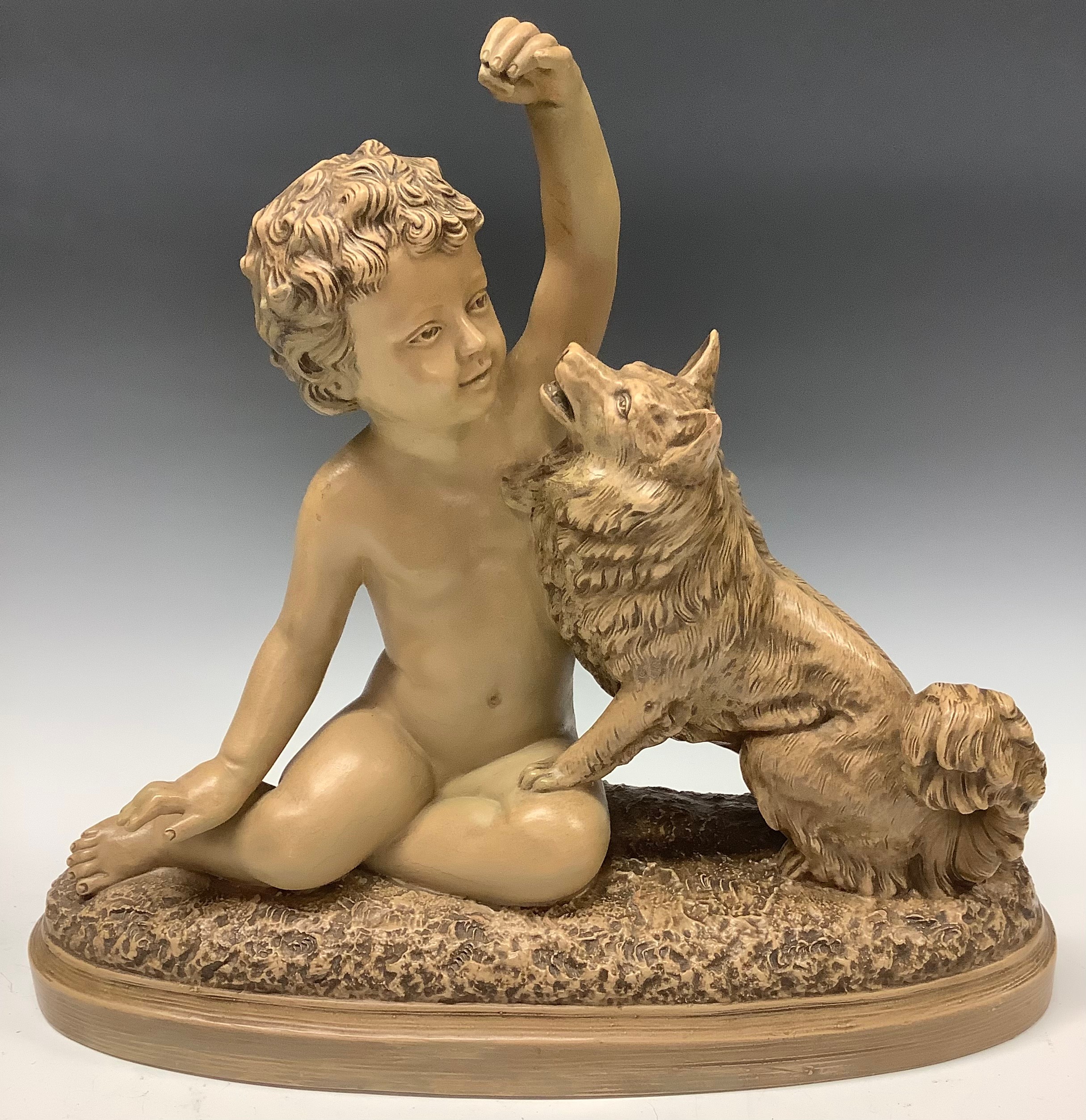 A French terracotta model of a child and dog companion, 37cm wide, 35cm high