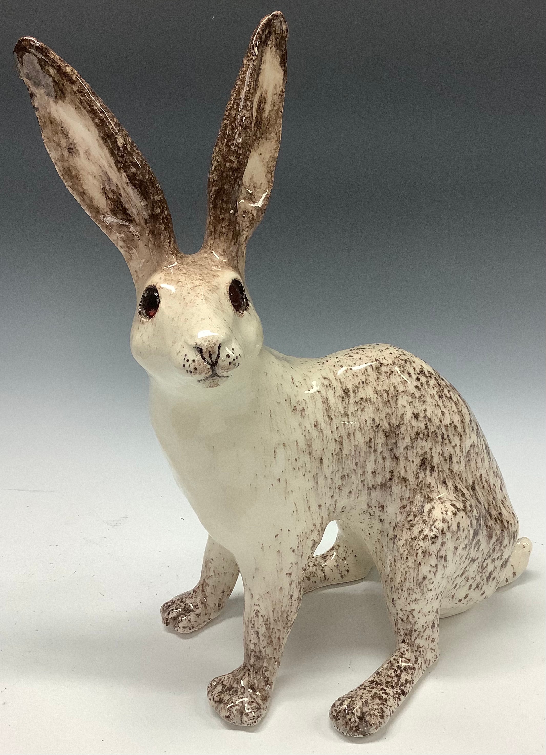 A large Winstanley model of a hare, glass eyes, 39cm, size 9, painted marks