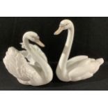 A Lladro model of a swan, 5231, 18cm, printed mark; another, 5230, printed mark (2)