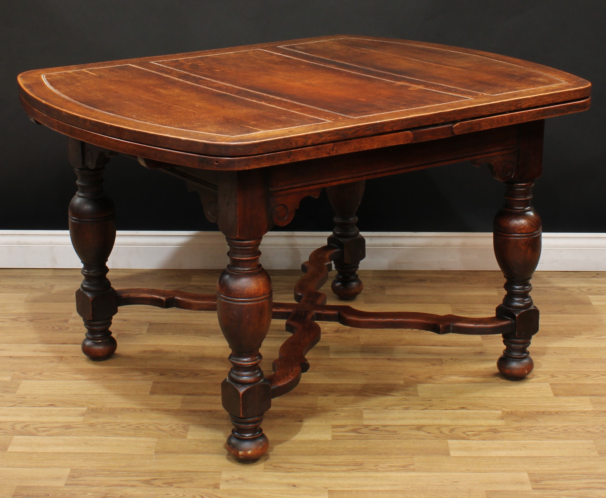 An early 20th century oak draw-leaf dining table, 76cm high, 129cm opening to 213cm long, 99cm wide - Image 3 of 3