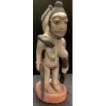 Tribal Art - a two headed deity with snake group, carved and painted wood, 62cm