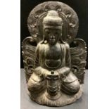 Tribal Art - a carved hardwood Buddha figure, 52cm