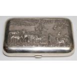 An Idian silver rounded rectangular cigar case, well chased with figures, cattle and deities, 11.5cm