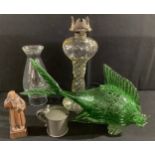 A novelty green glass fish, 38cm long; a clear glass oil lamp; a pewter hinged tankard mustard