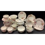 A Royal Crown Derby Posie pattern teapot, milk jug, sugar bowl, five teacups, assorted saucers and