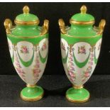 A pair of miniature Minton pedestal two handled vases and covers, printed and painted with