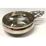 An 18th century silver porringer, pierced lug handle, 10.5cm diam, unmarked, 4.5oz