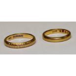 A 22ct gold wedding band, chased and engraved, size P, 5.18; another 22ct gold wedding band, size L,