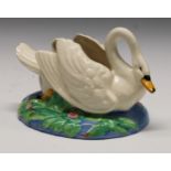 A Clarice Cliff posy holder modelled as a swan swimming on an oval lily pad pond, printed mark, 26cm