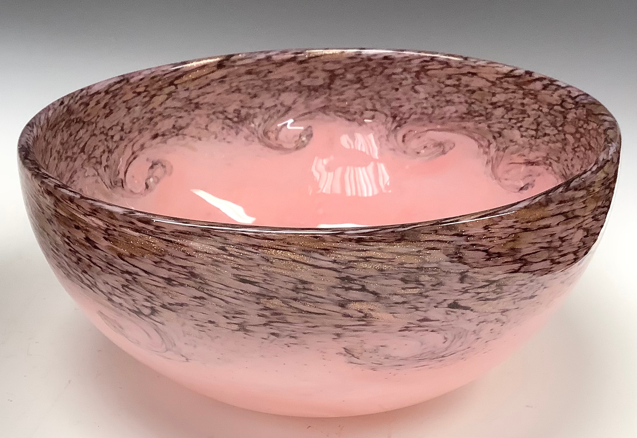 A Vasart type opaque glass bowl in swirls of pink flecked with purple and gold inclusions, 20cm