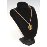 A 9ct gold necklace chain, suspended with a copper farthing, mounted in 9ct gold, total weight 10g