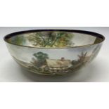 A Durley bowl, painted by James Skerrett, signed, the interior decorated with a Tudor style