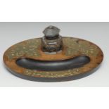 A Victorian brass mounted walnut oval inkstand, applied with leafy cut-card work, clear glass